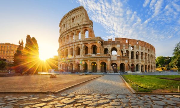 View of Colosseum in Rome and morning sun, Italy, Europe.